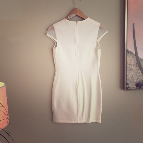 Size M white mini with sheer lining, never worn. - Picture 2 of 2